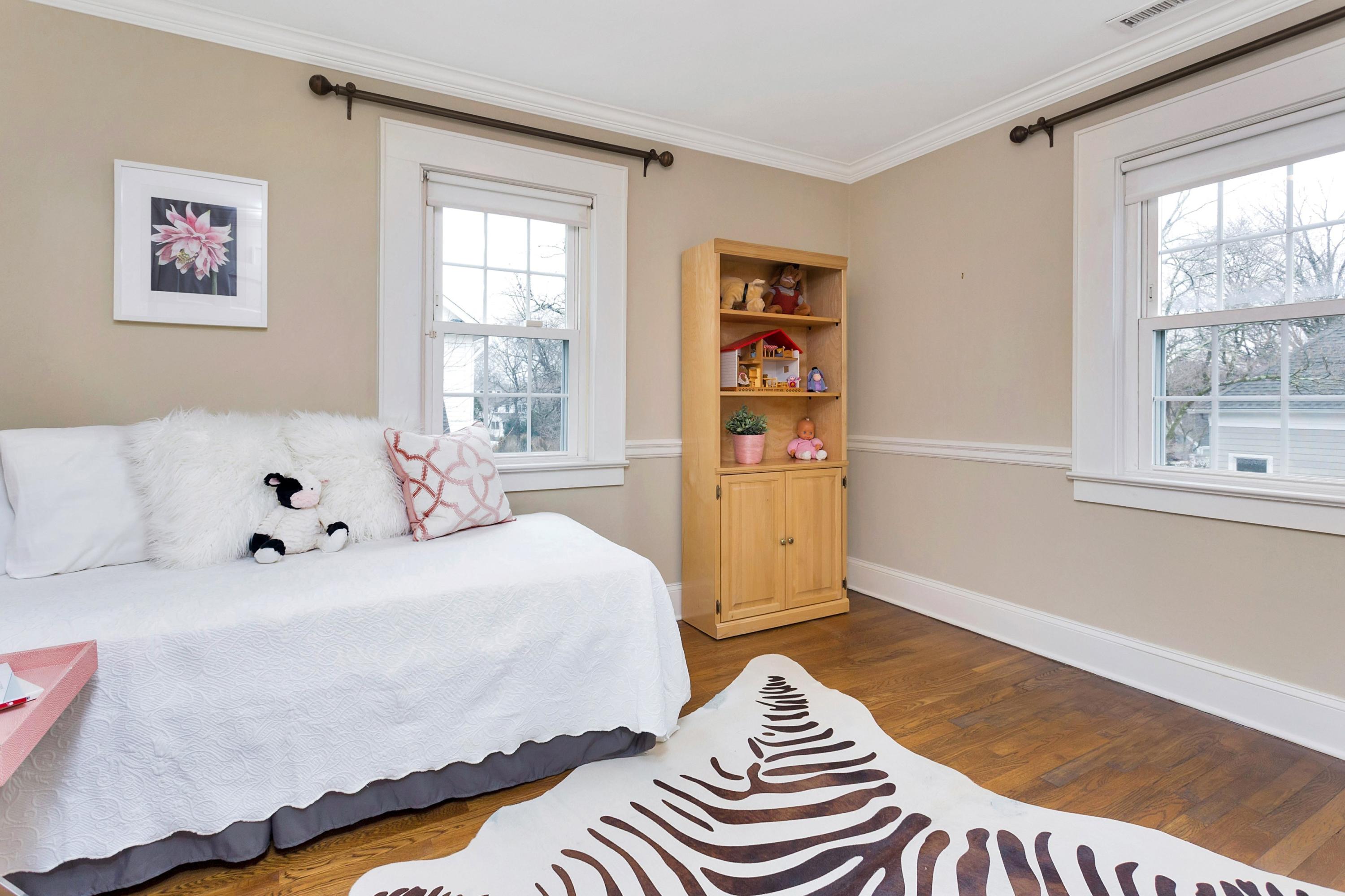 12 Dorchester Lane Riverside, CT 06878 - Photo 21 of 35 a bedroom with a bed and a window