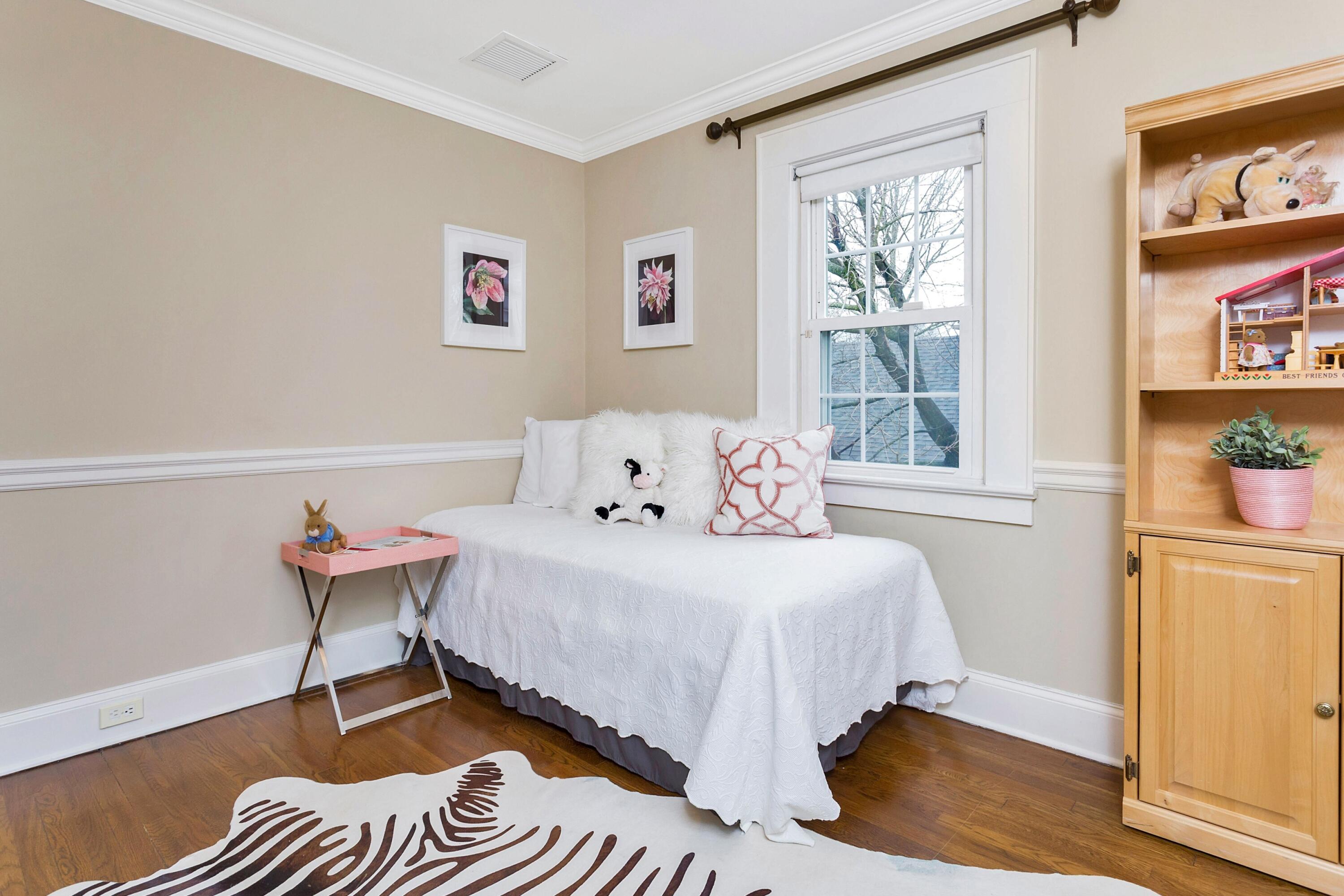 12 Dorchester Lane Riverside, CT 06878 - Photo 22 of 35 a bedroom with a bed and wooden floor