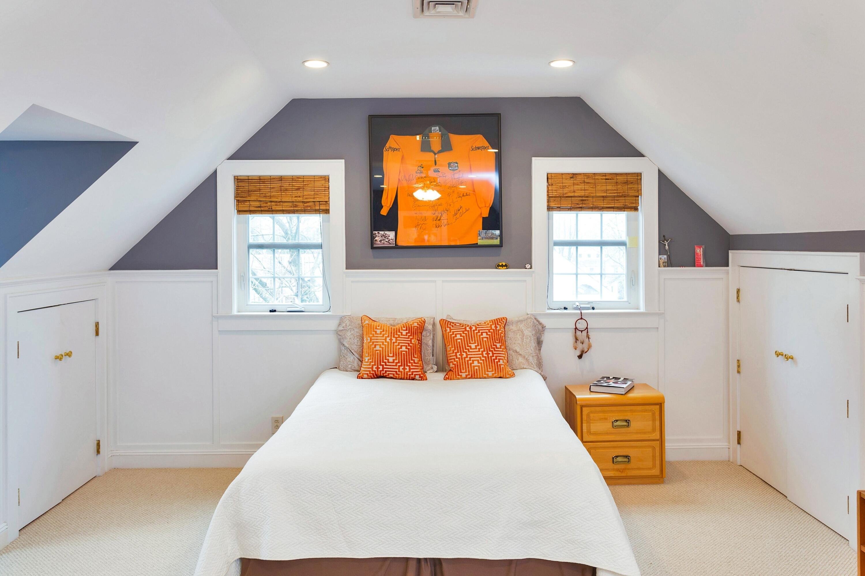 12 Dorchester Lane Riverside, CT 06878 - Photo 24 of 35 a bedroom with a bed and window