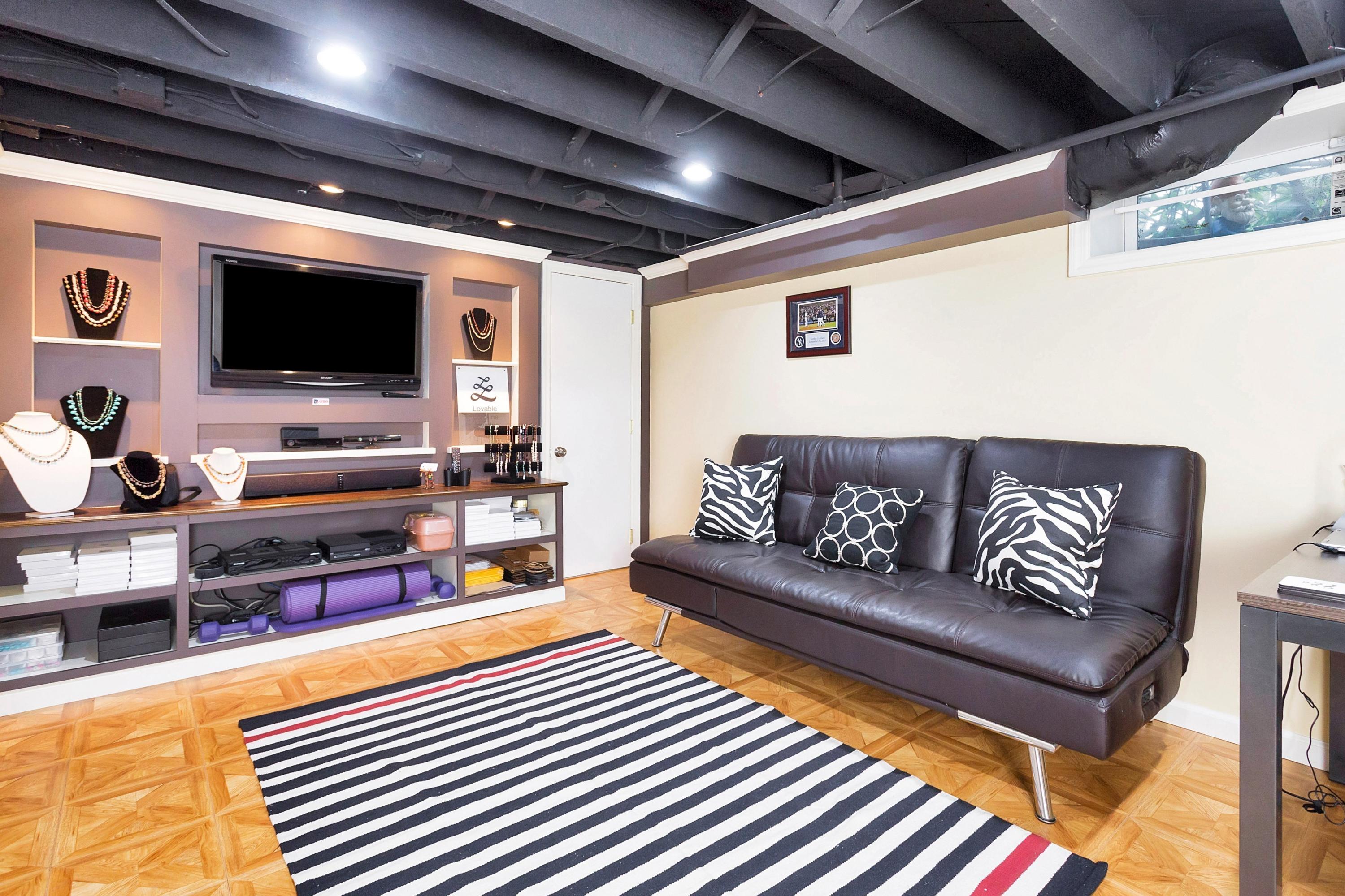 12 Dorchester Lane Riverside, CT 06878 - Photo 27 of 35 a living room with furniture and a flat screen tv