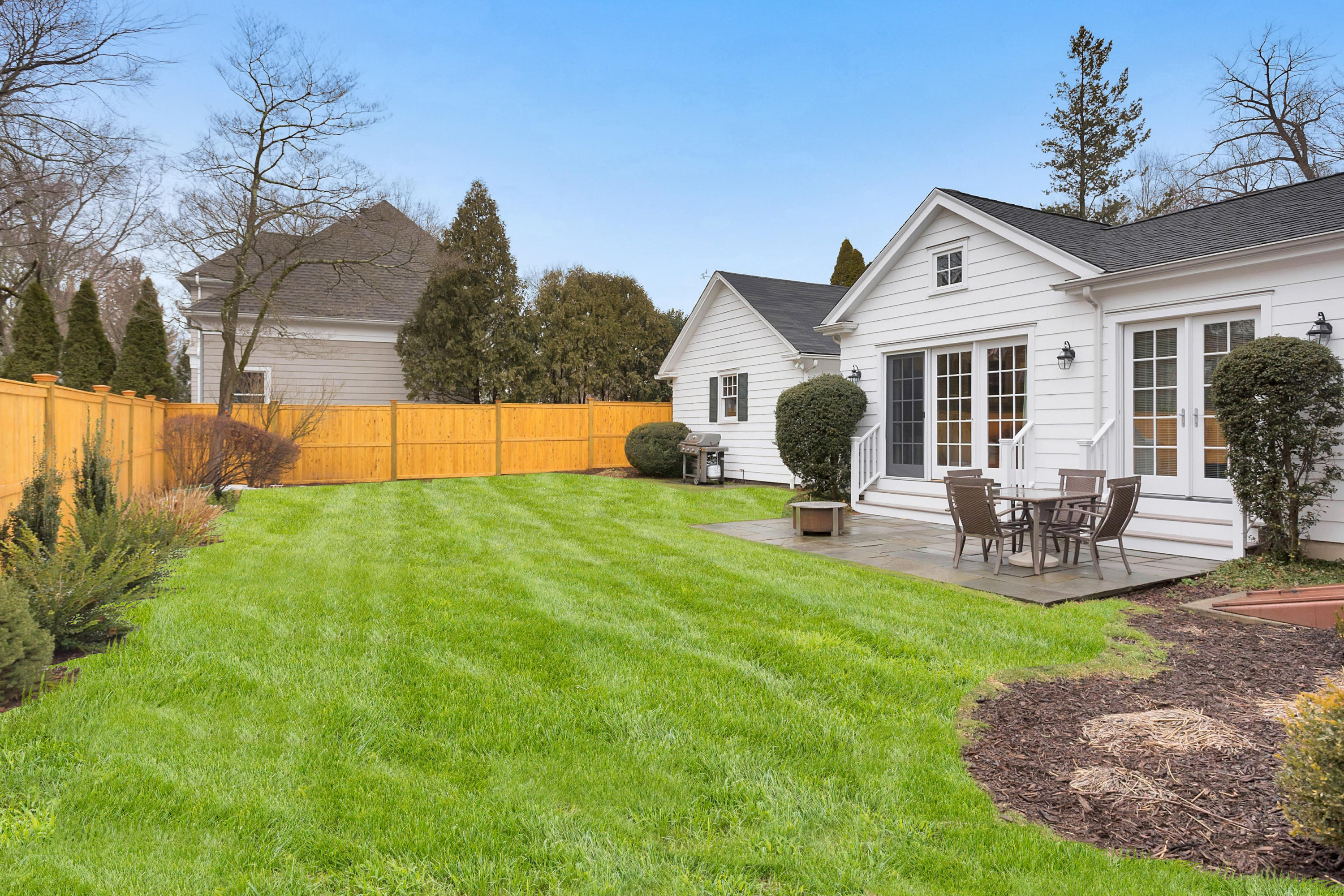 12 Dorchester Lane Riverside, CT 06878 - Photo 31 of 35 a view of a house with backyard and sitting area