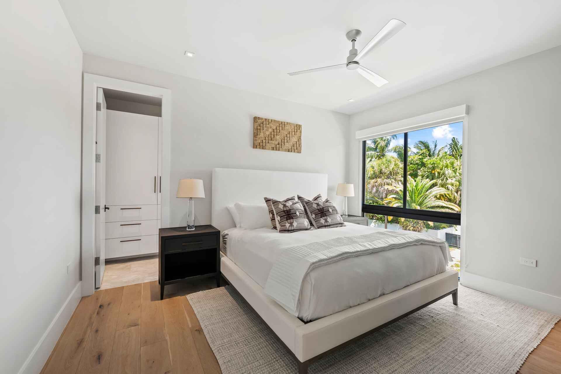 5288 Alton Road, Unit 3 Miami Beach, FL 33140 - Photo 16 of 33 a bedroom with a large bed and a window