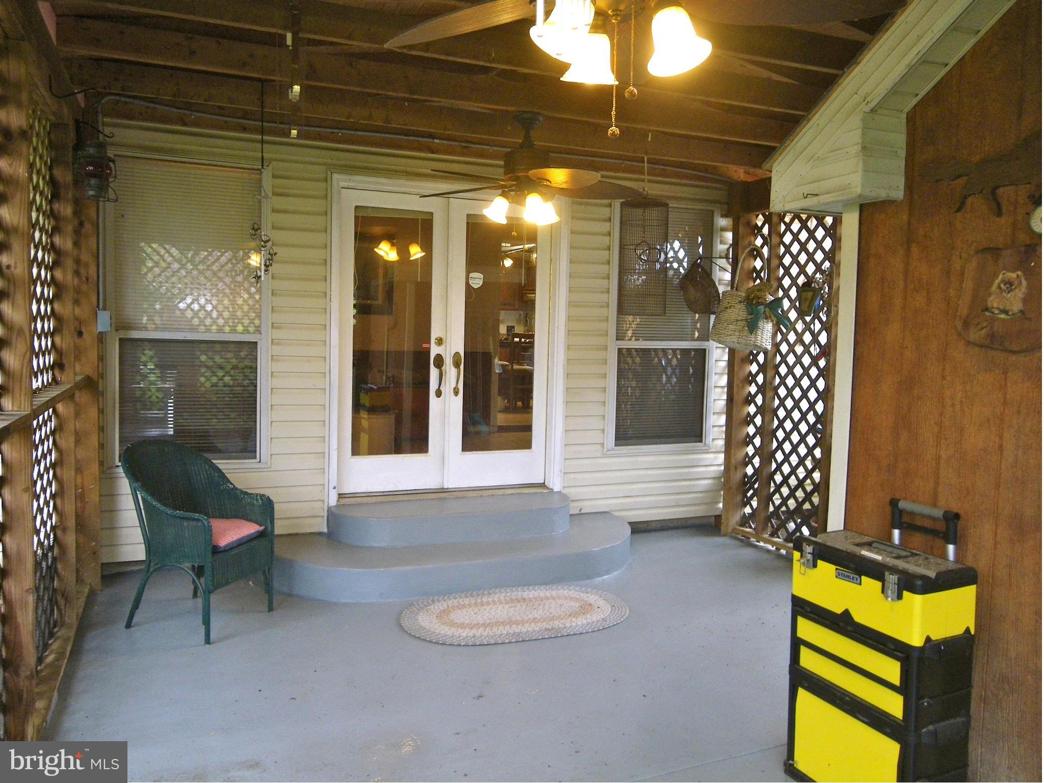 9262 Elk Run Road Catlett, VA 20119 - Photo 6 of 30 Covered Patio with Lattice and attached Shed