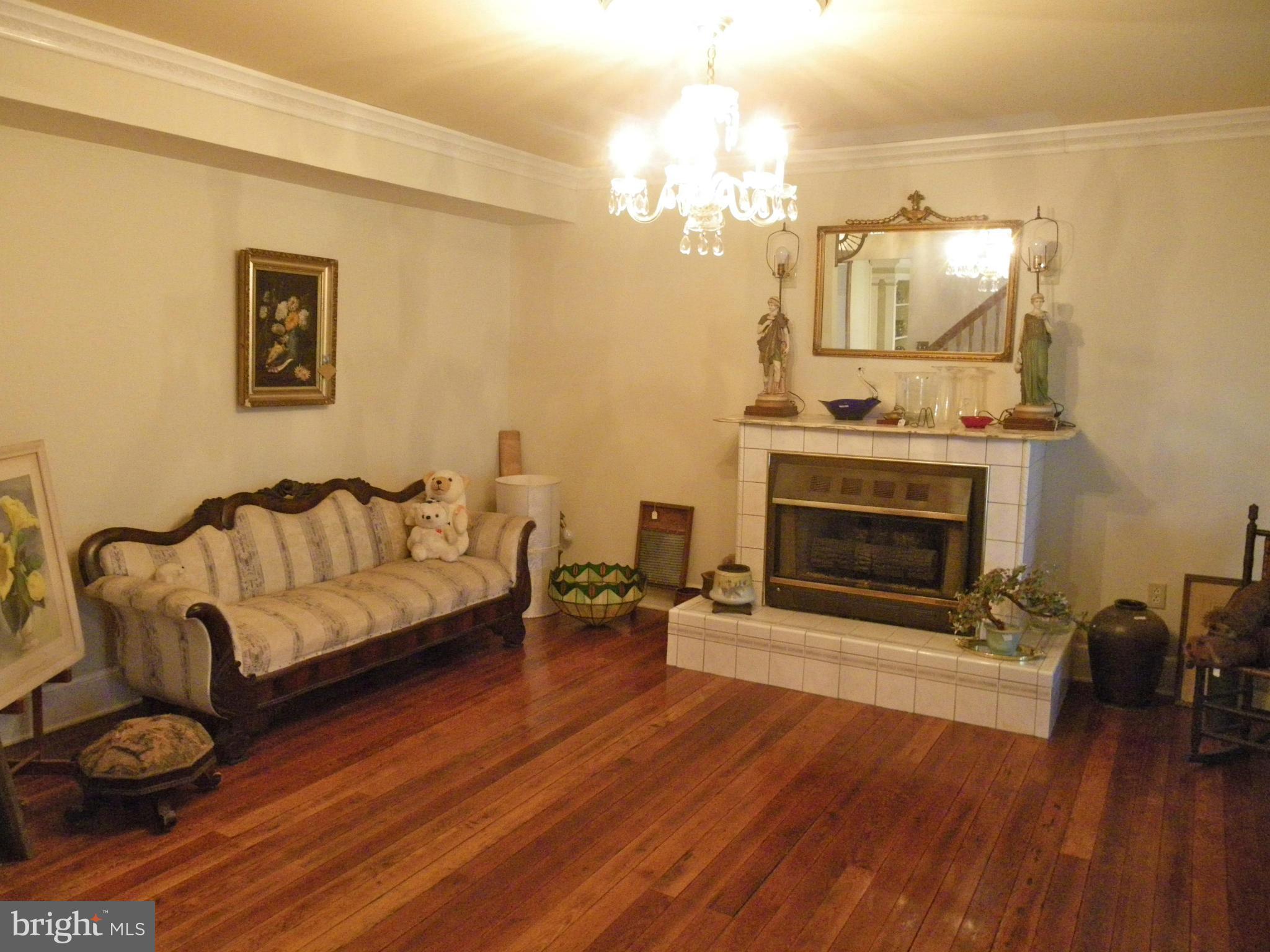 9262 Elk Run Road Catlett, VA 20119 - Photo 7 of 30 Parlor with Wood Floors and Fireplace