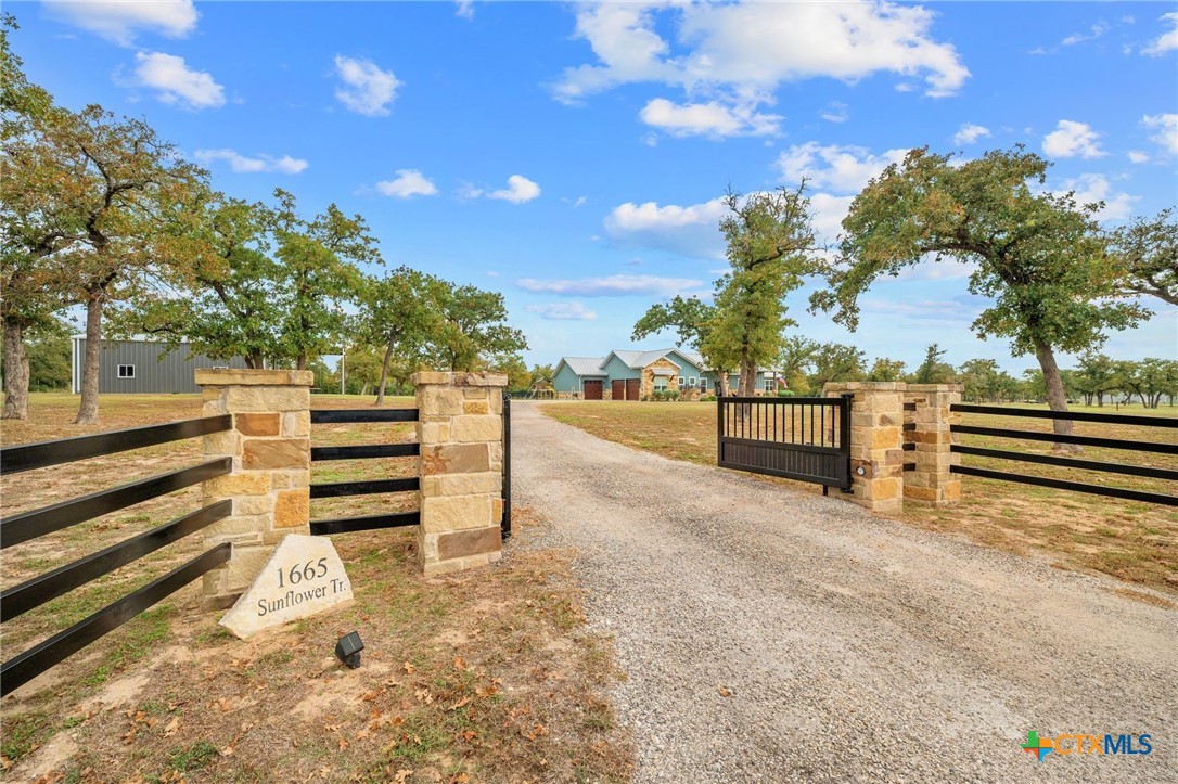 1665 Sunflower Trail Luling, TX 78648 - Photo 2 of 46 a view of outdoor space with deck and tree