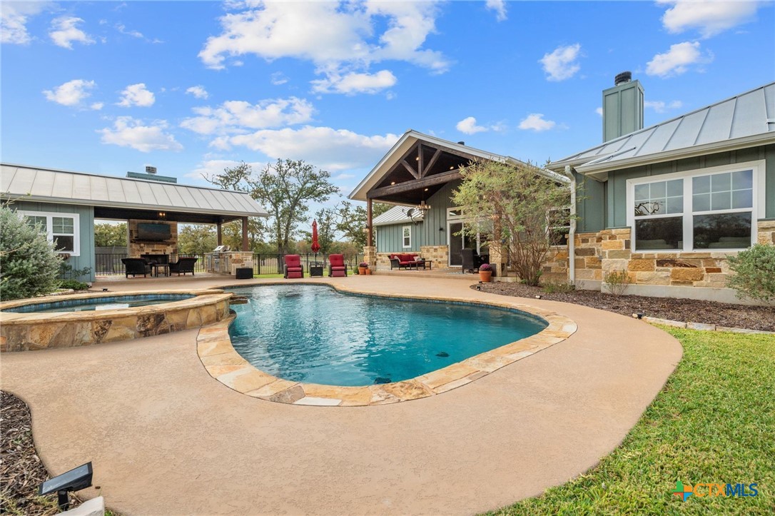 1665 Sunflower Trail Luling, TX 78648 - Photo 39 of 46 a view of a house with swimming pool and sitting area