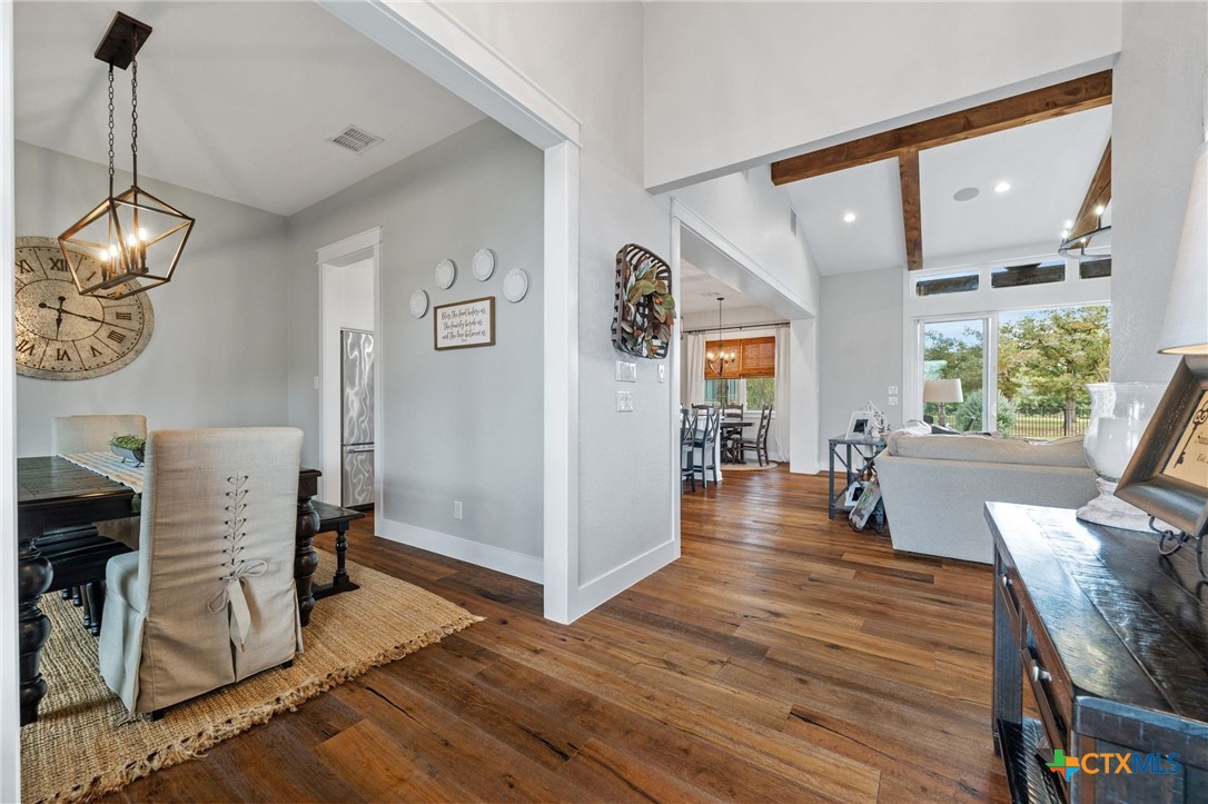 1665 Sunflower Trail Luling, TX 78648 - Photo 6 of 46 a view of a livingroom with wooden floor and furniture