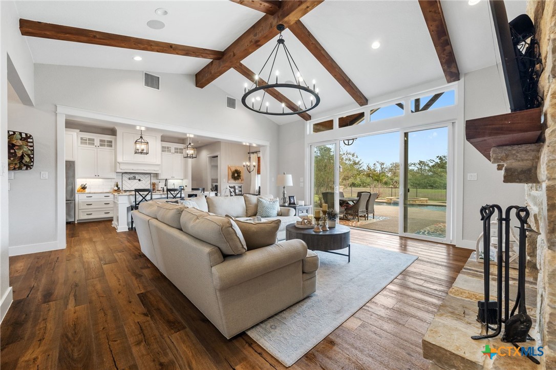 1665 Sunflower Trail Luling, TX 78648 - Photo 8 of 46 a living room with furniture or kitchen and a large window