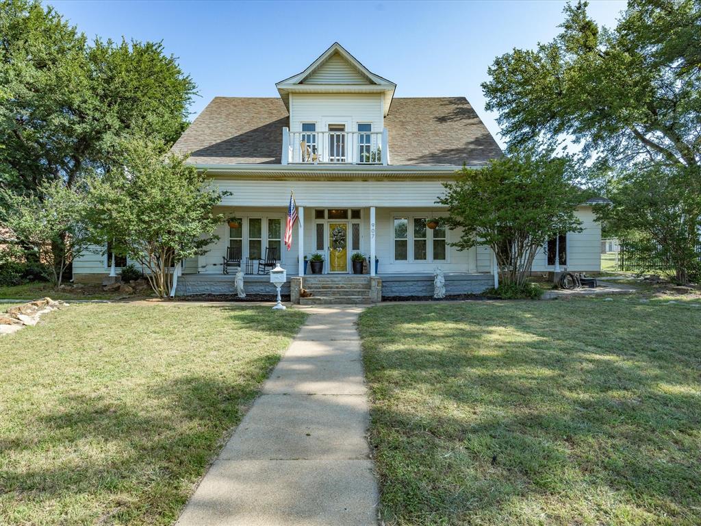 907 4th Street Graham, TX 76450 - Photo 1 of 34 a front view of a house with swimming pool