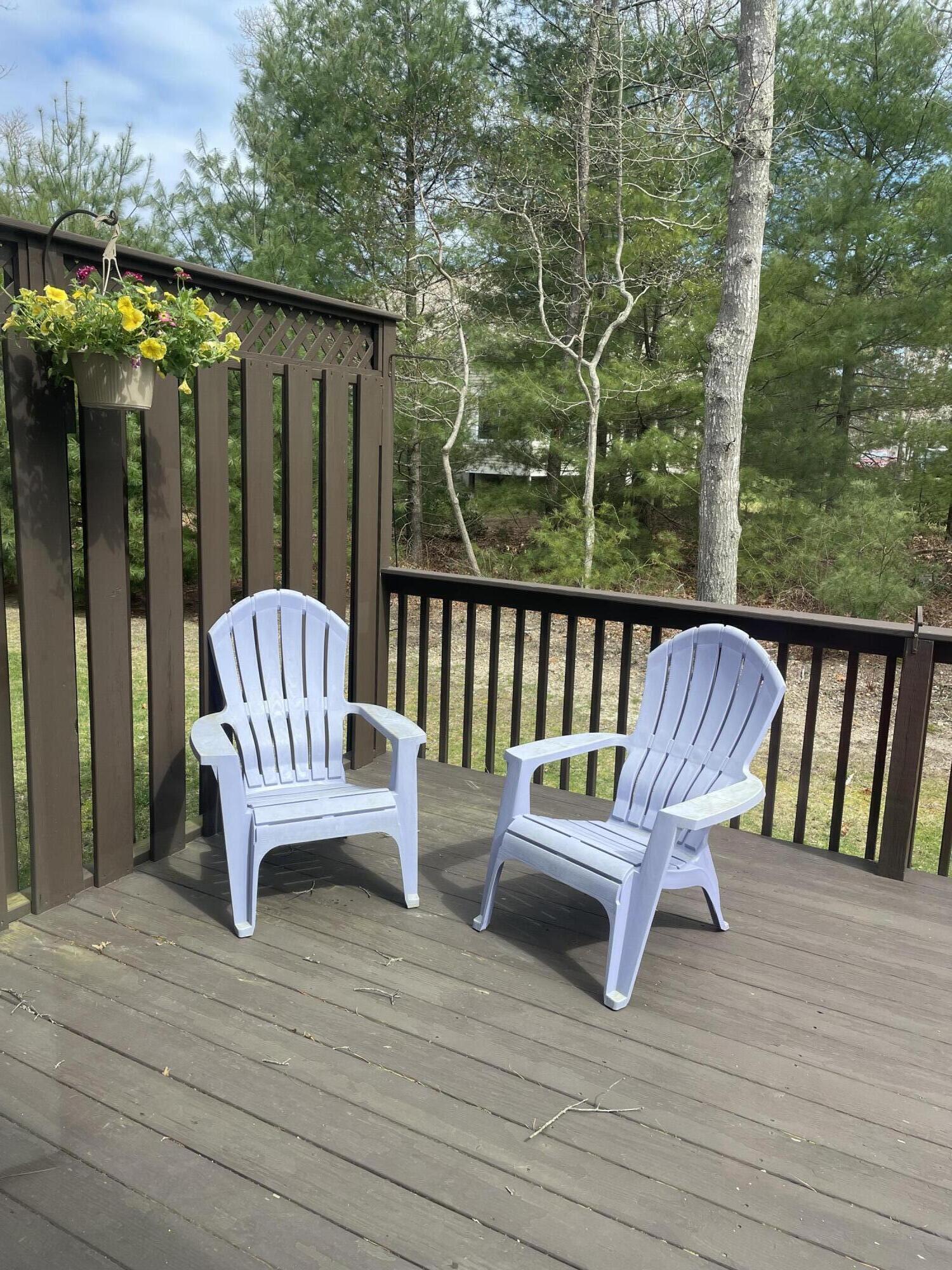 14 Chadwick Court Mashpee, MA 02649 - Photo 12 of 31 a view of a chair and table on the wooden deck
