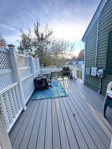 a room with wooden floor furniture and a flat screen tv