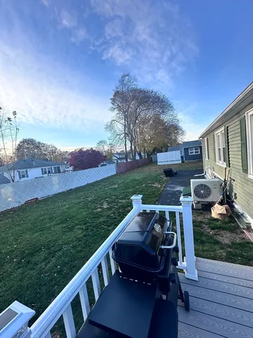 a living room with furniture window and wooden floor
