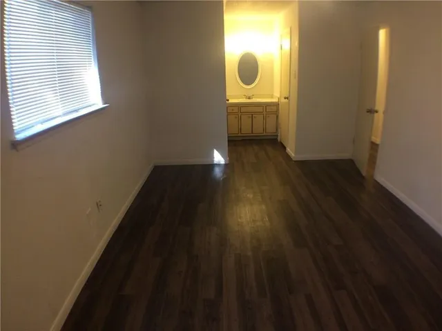 a view of a sink and wooden floor