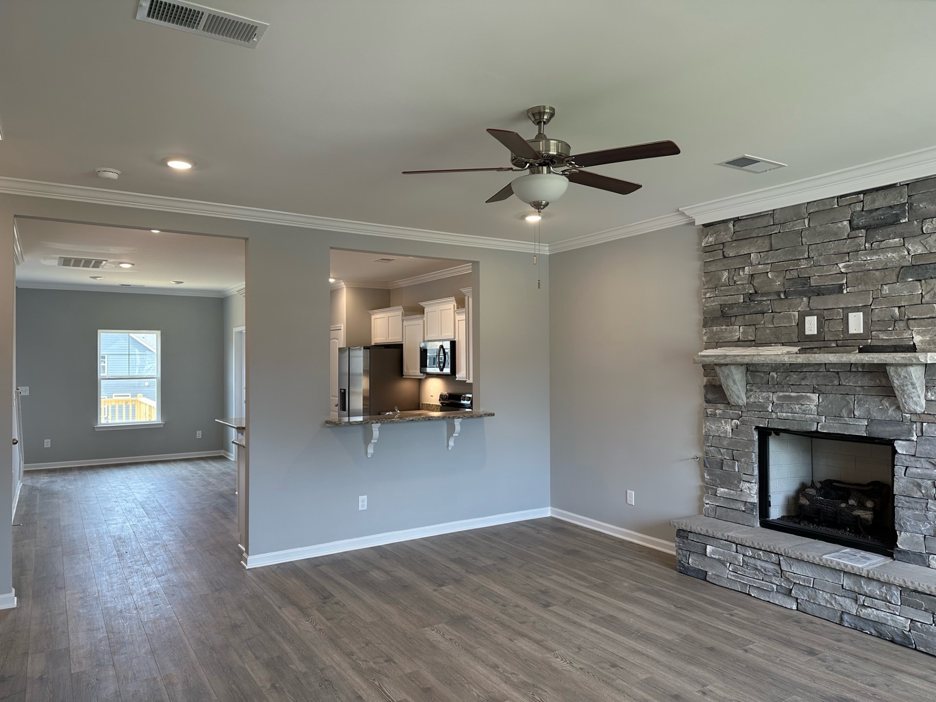 1026 Wiseman Farm Road Fairview, TN 37062 - Photo 2 of 7 a view of a livingroom with wooden floor and a fireplace