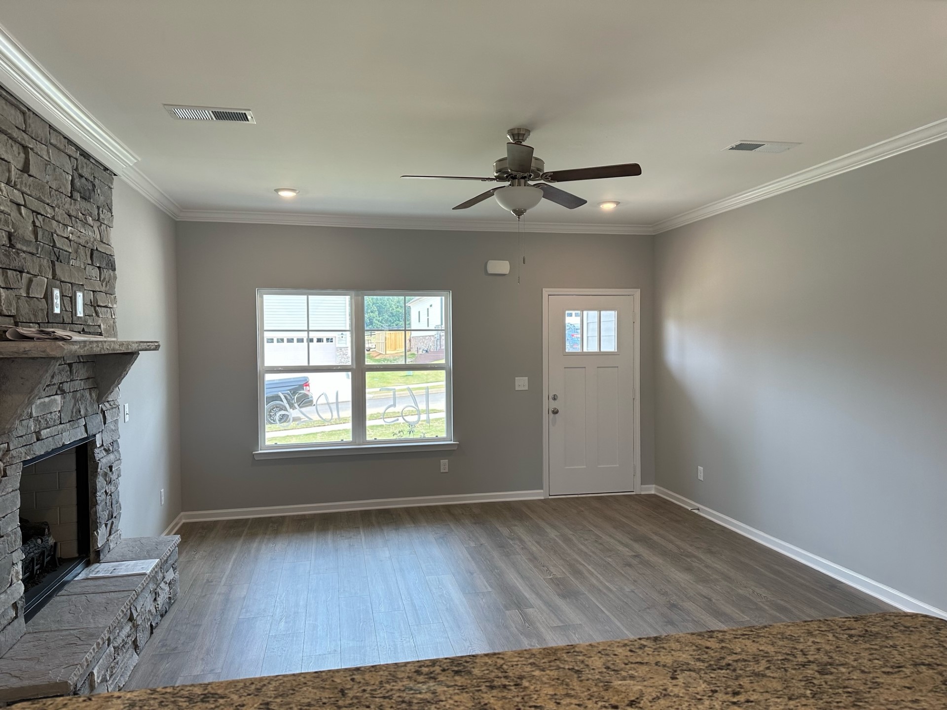 1026 Wiseman Farm Road Fairview, TN 37062 - Photo 6 of 7 a view of an empty room with a fireplace and a window