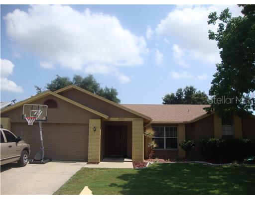 8057 Perth Drive Largo, FL 33773 - Photo 1 of 1 a front view of a house with garden