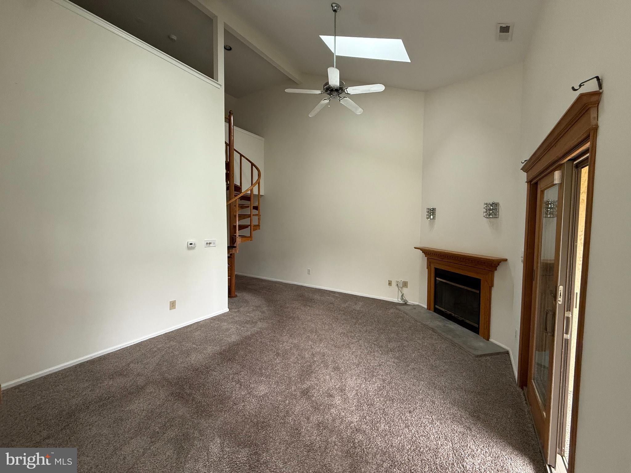 339 Georgia Court Sewell, NJ 08080 - Photo 11 of 12 an empty room with windows and fireplace