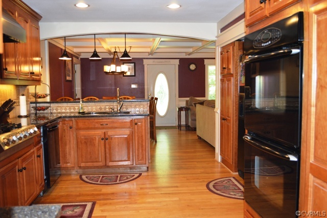 17216 Hamilton Arms Road Dewitt, VA 23840 - Photo 11 of 24 a kitchen with a refrigerator and a stove