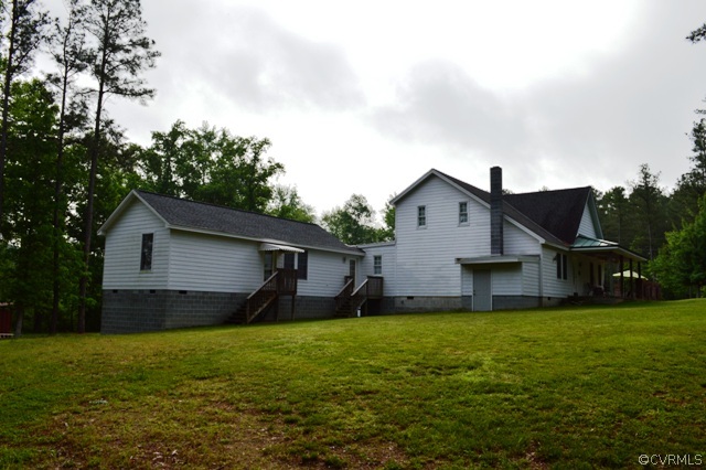 17216 Hamilton Arms Road Dewitt, VA 23840 - Photo 2 of 24 a house view with a garden space