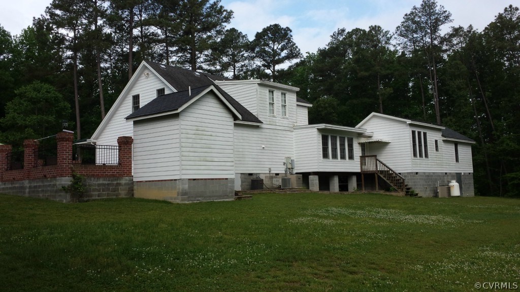 17216 Hamilton Arms Road Dewitt, VA 23840 - Photo 3 of 24 a front view of a house with a garden and yard