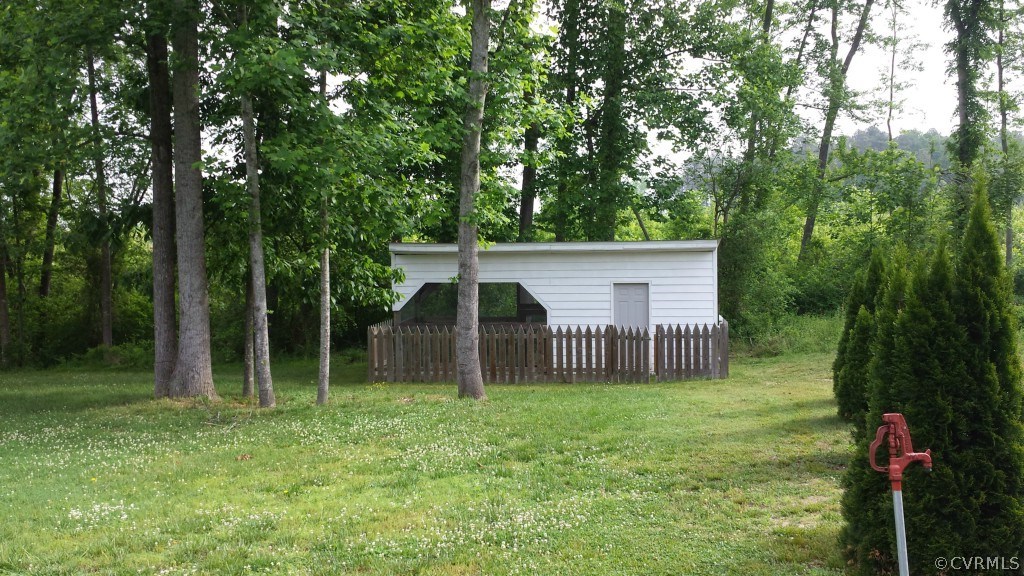 17216 Hamilton Arms Road Dewitt, VA 23840 - Photo 5 of 24 a house view with a backyard space