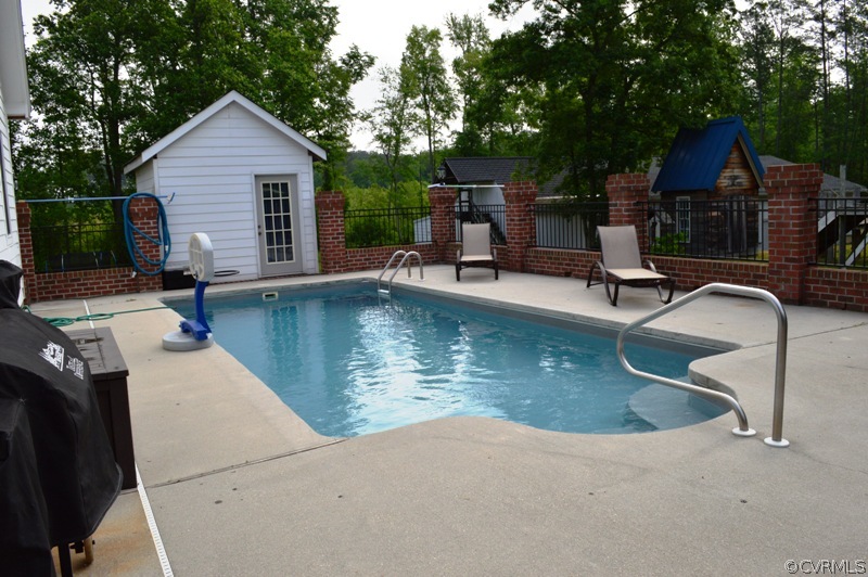 17216 Hamilton Arms Road Dewitt, VA 23840 - Photo 6 of 24 a view of a house with pool and chairs