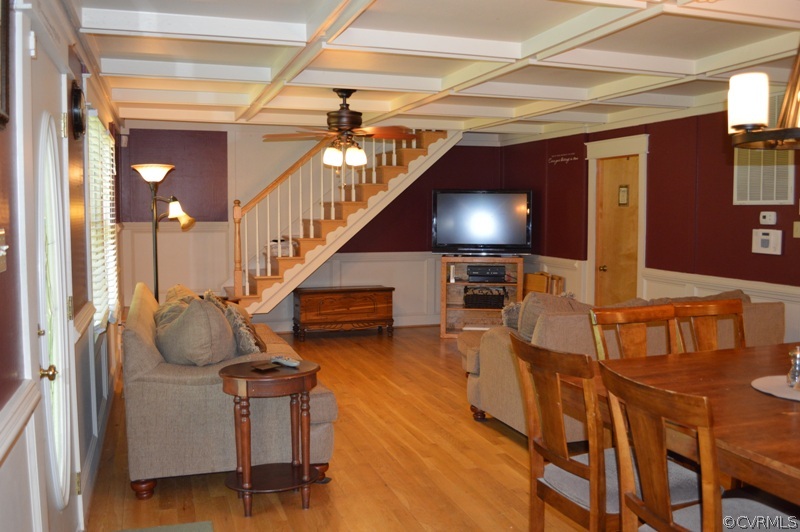 17216 Hamilton Arms Road Dewitt, VA 23840 - Photo 7 of 24 a living room with furniture and a chandelier