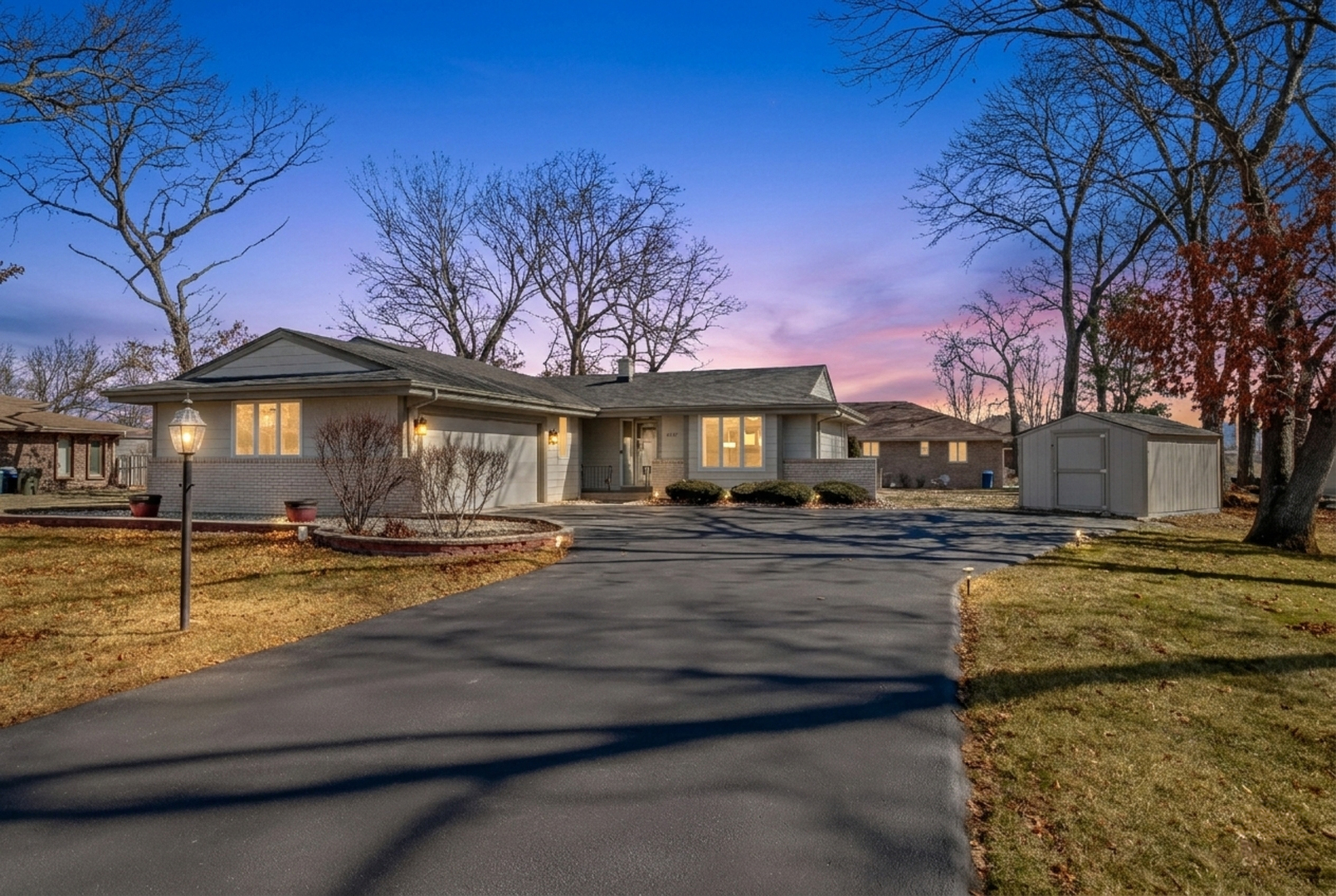 a view of swimming pool with outdoor seating and house in the background