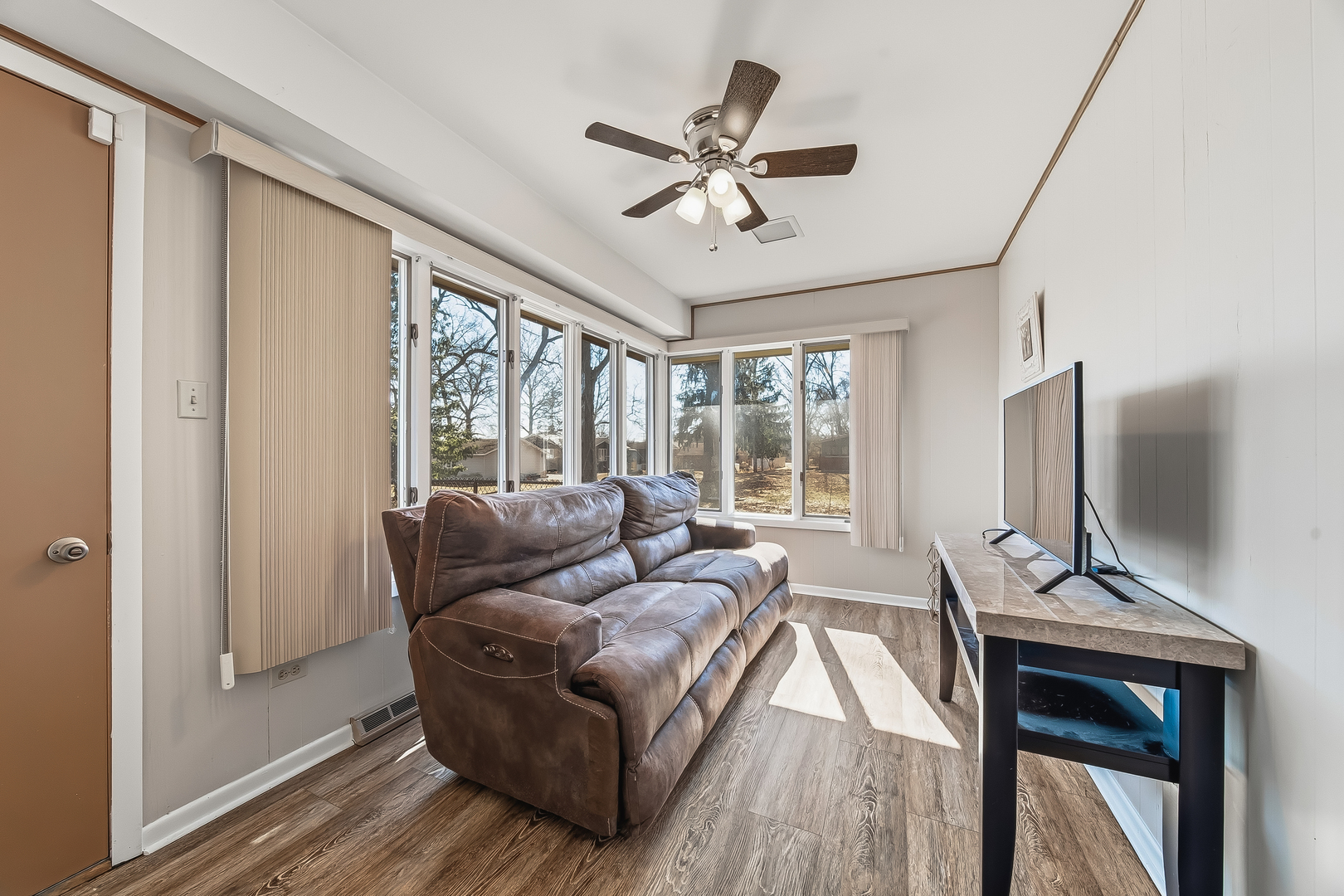 18317 Harper Street Lansing, IL 60438 - Photo 11 of 26 a living room with furniture and a flat screen tv