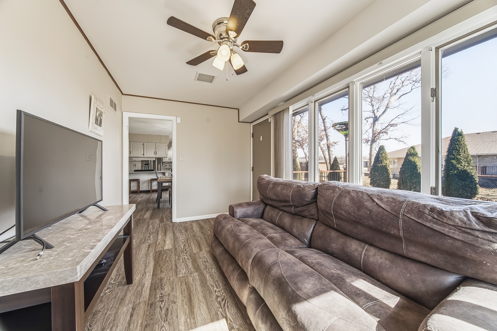 18317 Harper Street Lansing, IL 60438 - Photo 12 of 26 a living room with furniture and a flat screen tv