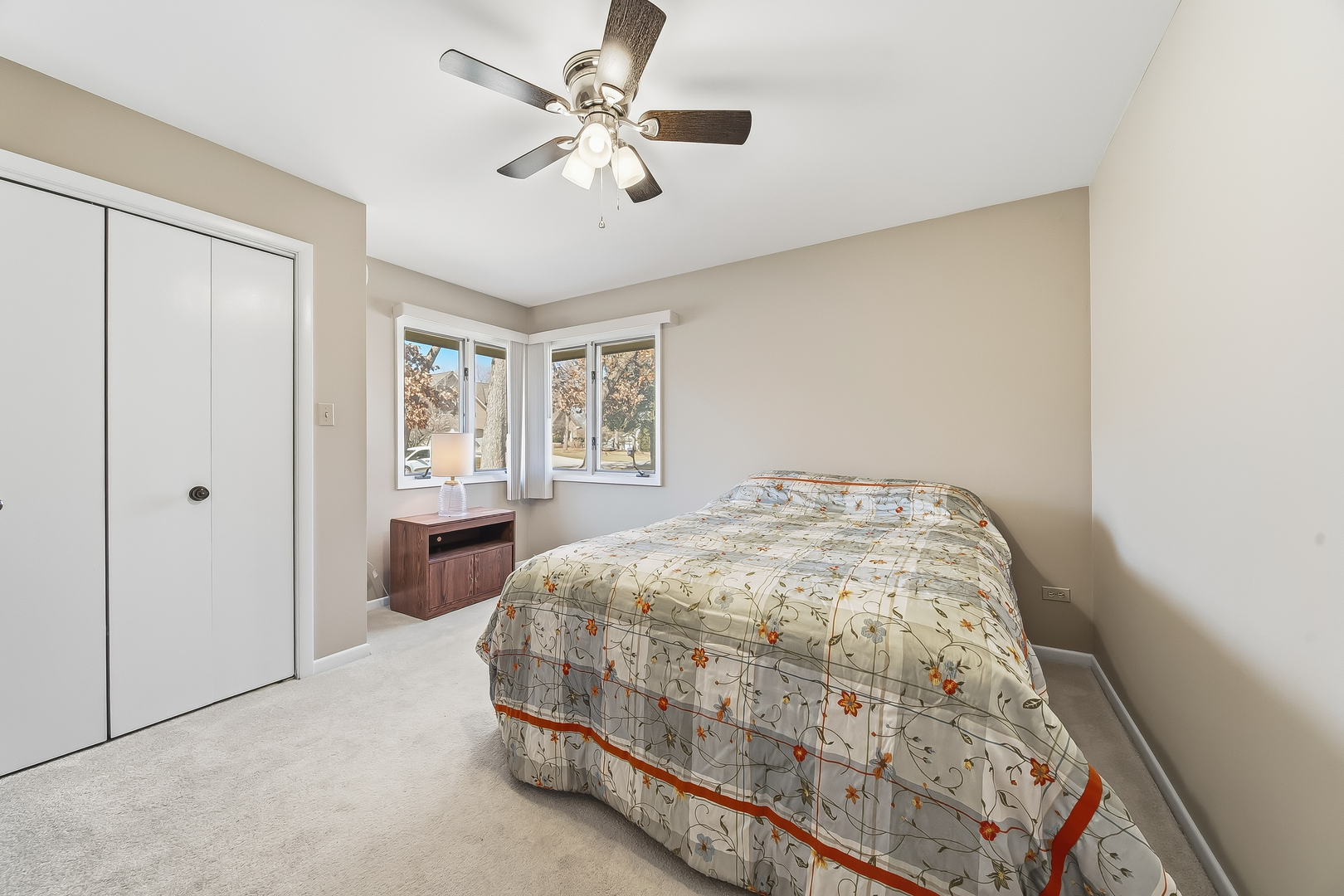 18317 Harper Street Lansing, IL 60438 - Photo 18 of 26 a bedroom with a bed and a window