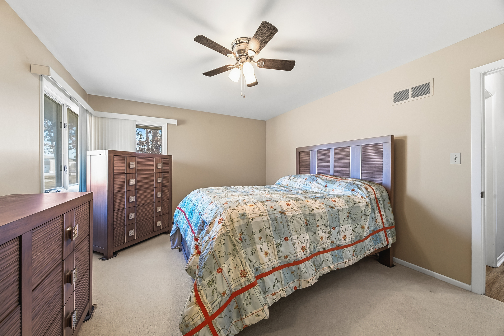 18317 Harper Street Lansing, IL 60438 - Photo 21 of 26 a bedroom with a bed and cabinet