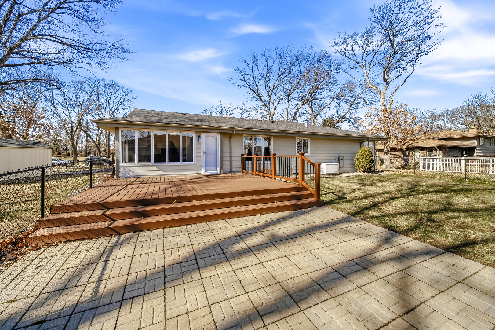 18317 Harper Street Lansing, IL 60438 - Photo 4 of 26 a front view of a house with a garden