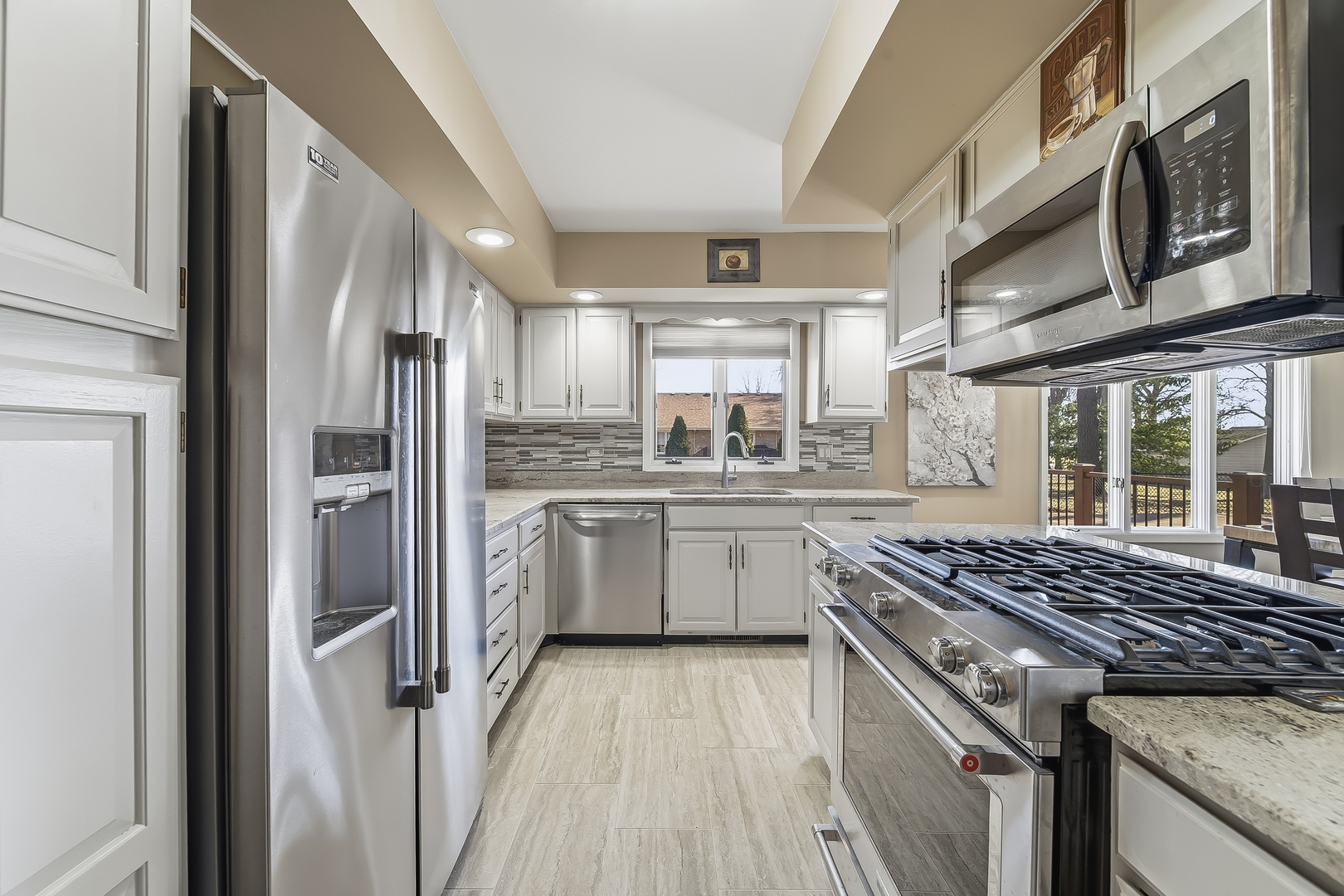 18317 Harper Street Lansing, IL 60438 - Photo 8 of 26 a kitchen with a stove a sink dishwasher a refrigerator and wooden cabinets