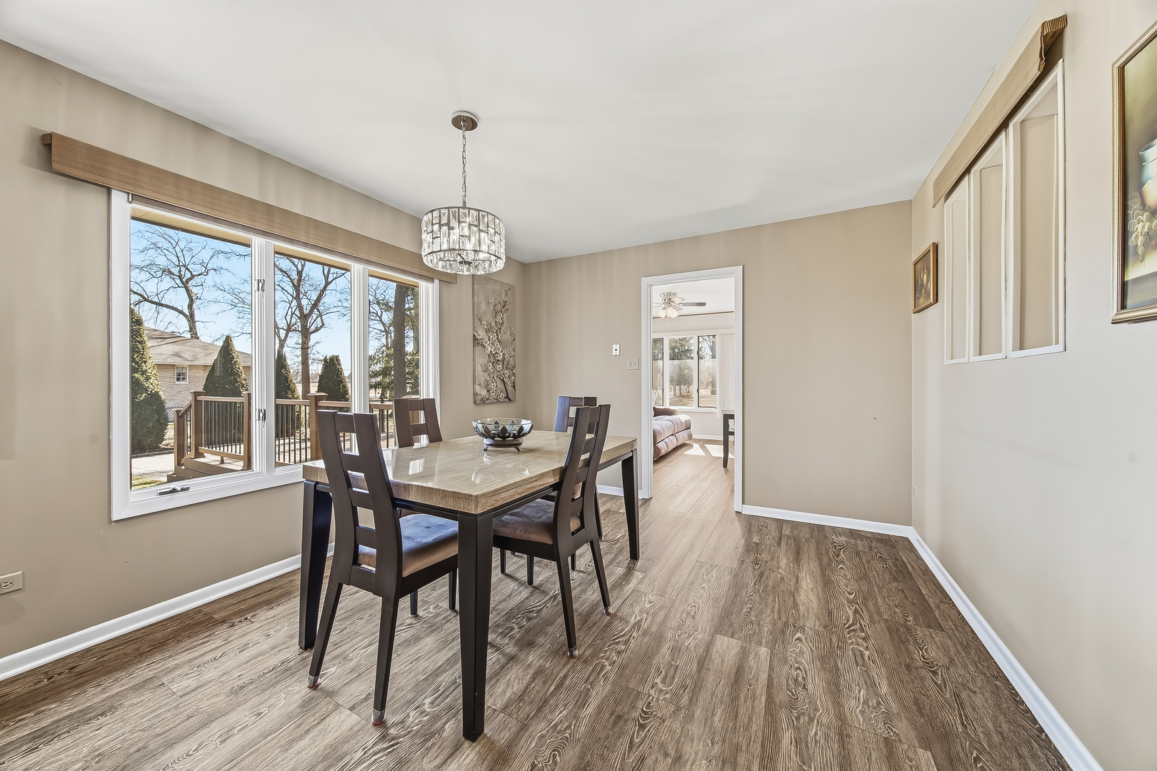 18317 Harper Street Lansing, IL 60438 - Photo 10 of 26 a view of a dining room with furniture window and wooden floor