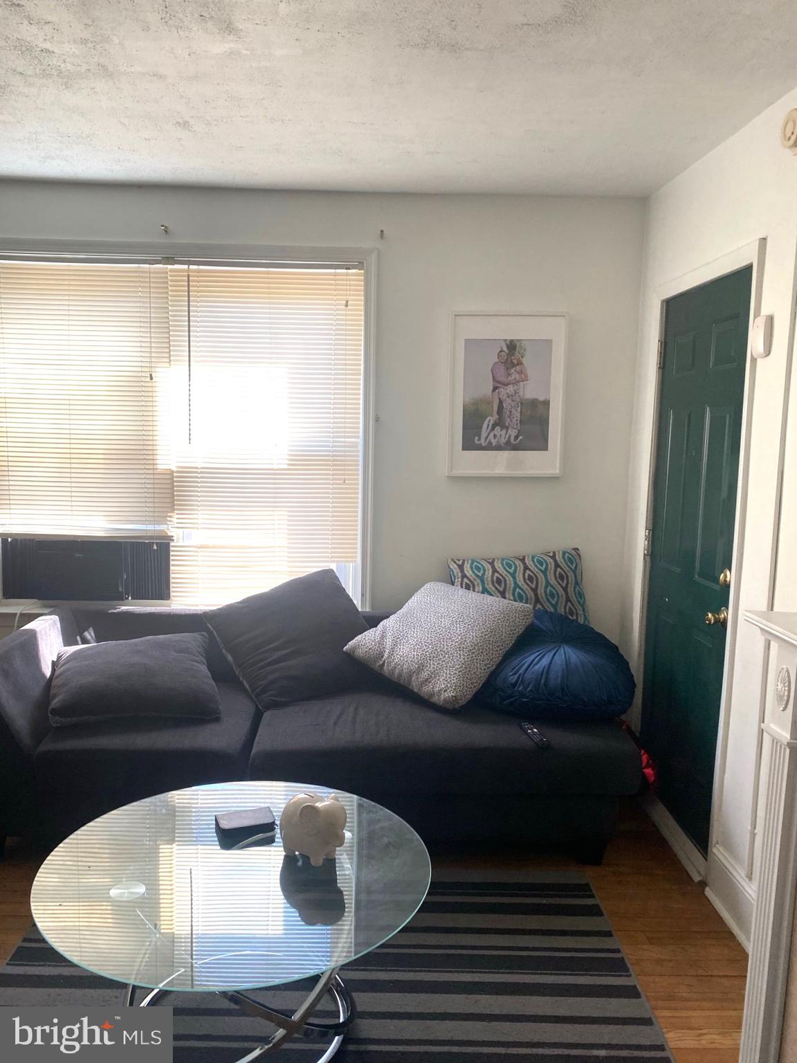5817 Keystone Street, Unit A Philadelphia, PA 19135 - Photo 16 of 27 a living room with furniture and a couch