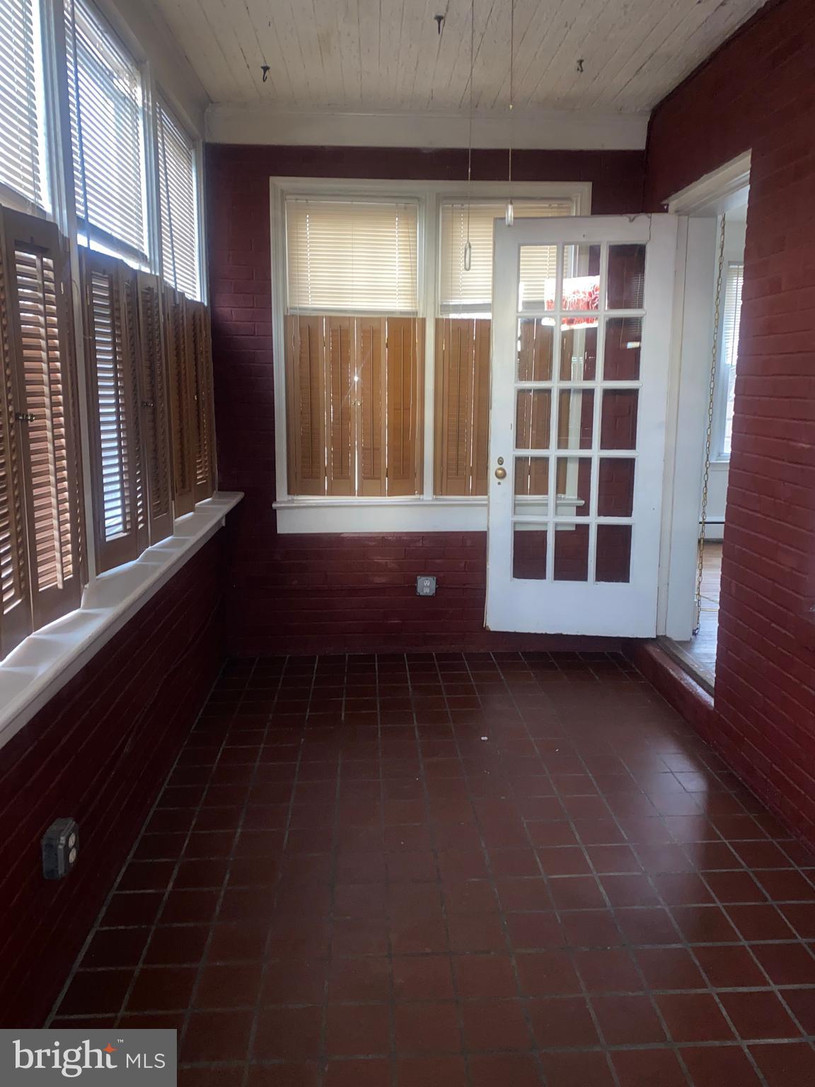 5817 Keystone Street, Unit A Philadelphia, PA 19135 - Photo 17 of 27 a view of an empty room with a window