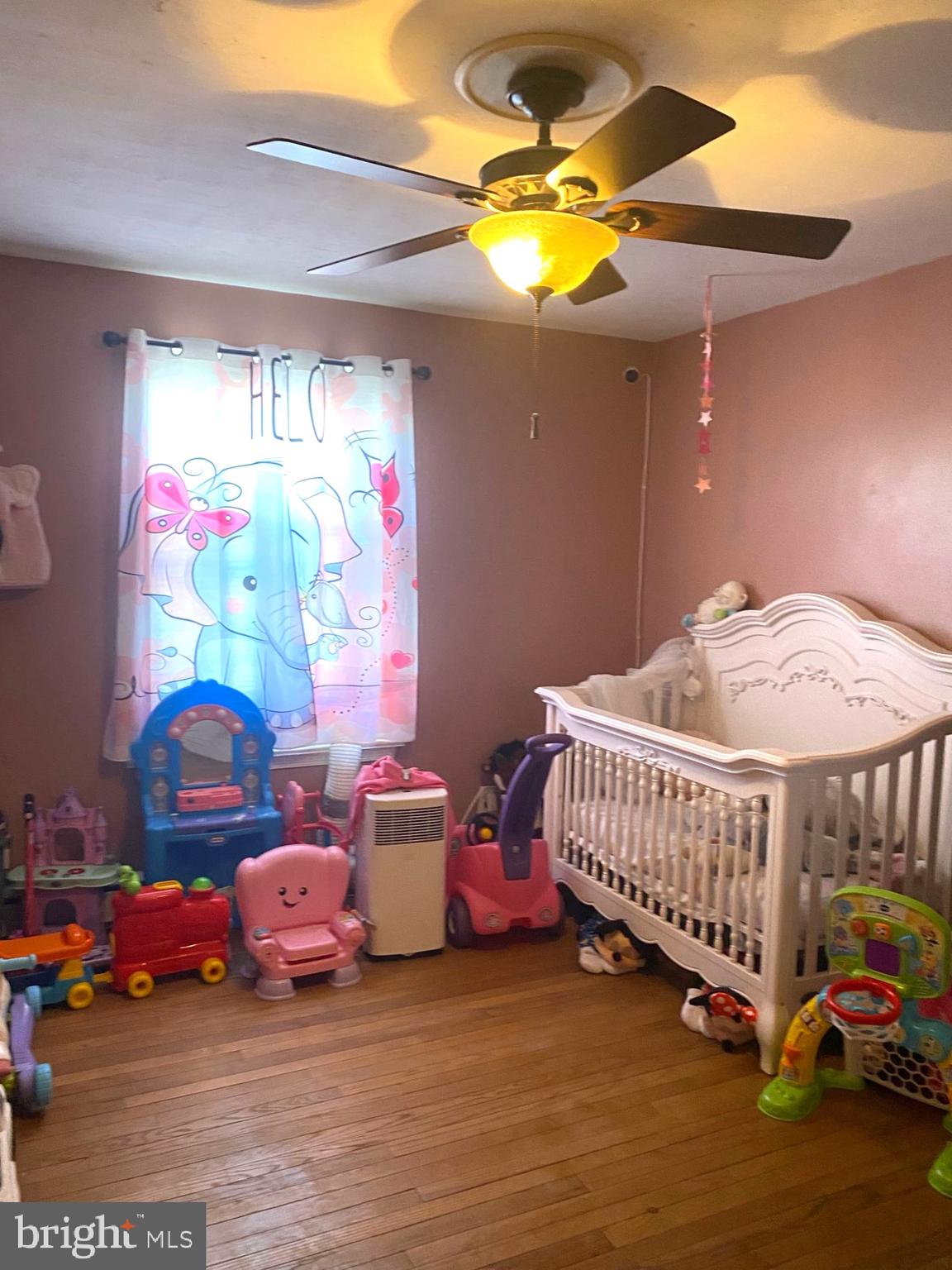 5817 Keystone Street, Unit A Philadelphia, PA 19135 - Photo 23 of 27 a bedroom with bed and a chandelier