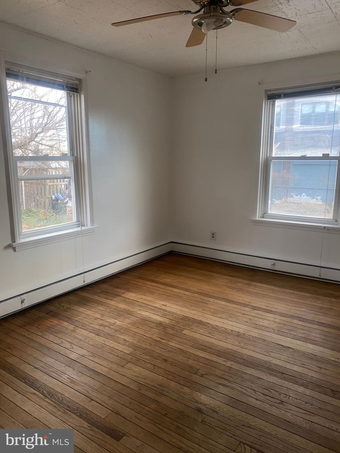 5817 Keystone Street, Unit A Philadelphia, PA 19135 - Photo 4 of 27 an empty room with a window