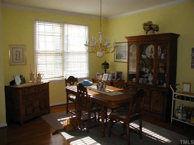 700 Neuse Ridge Drive Clayton, NC 27527 - Photo 4 of 10 a view of a dining room with furniture and chandelier