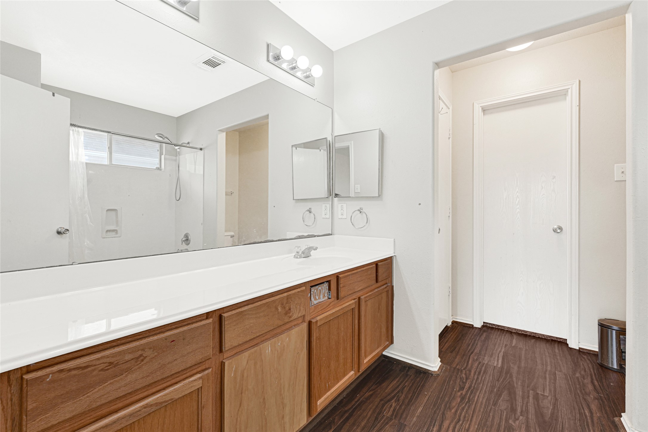 3431 Princeton Point Court Houston, TX 77047 - Photo 14 of 23 a room with a sink cabinets and wooden floor