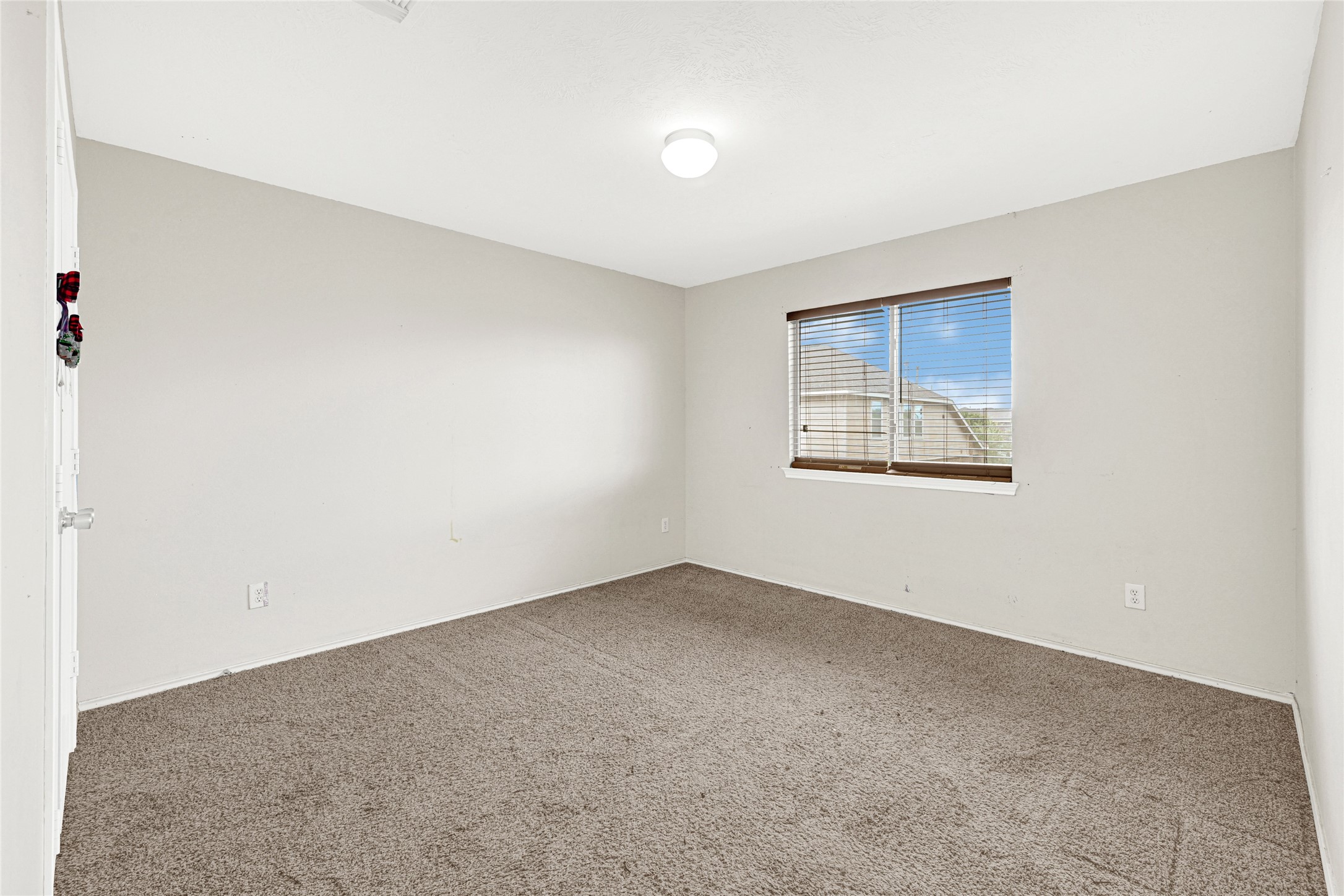 3431 Princeton Point Court Houston, TX 77047 - Photo 17 of 23 an empty room with a window