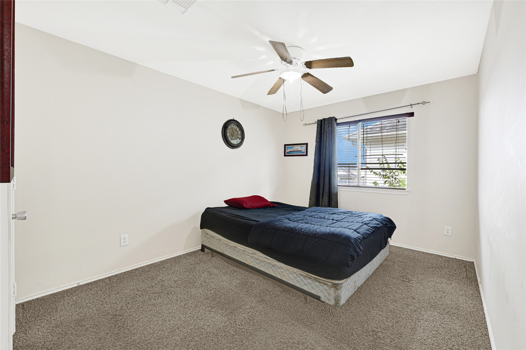 3431 Princeton Point Court Houston, TX 77047 - Photo 18 of 23 a living room with a bed furniture and a window