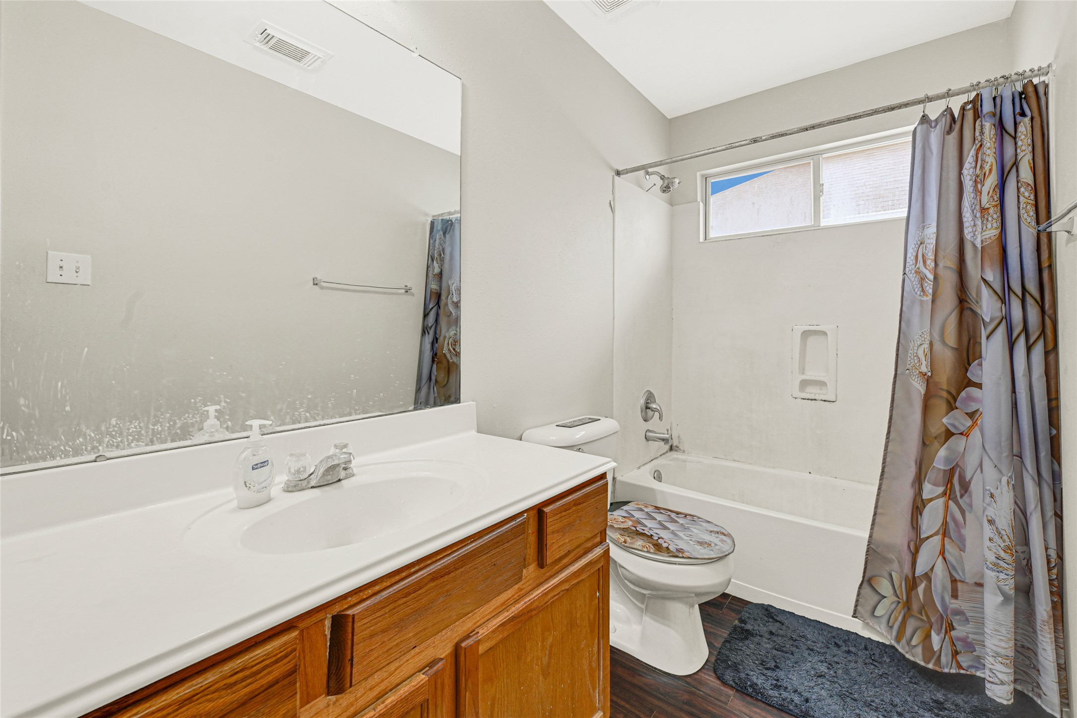 3431 Princeton Point Court Houston, TX 77047 - Photo 19 of 23 a bathroom with a granite countertop sink toilet a shower and a bathtub