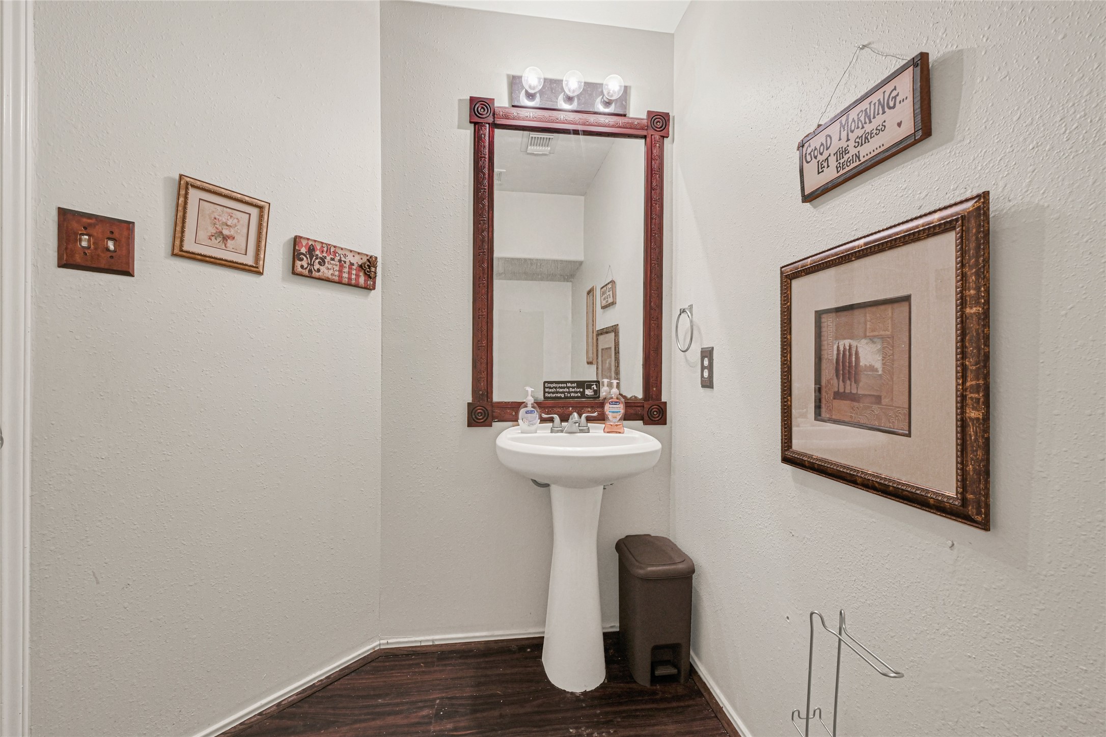 3431 Princeton Point Court Houston, TX 77047 - Photo 10 of 23 a bathroom with a sink a mirror and a toilet