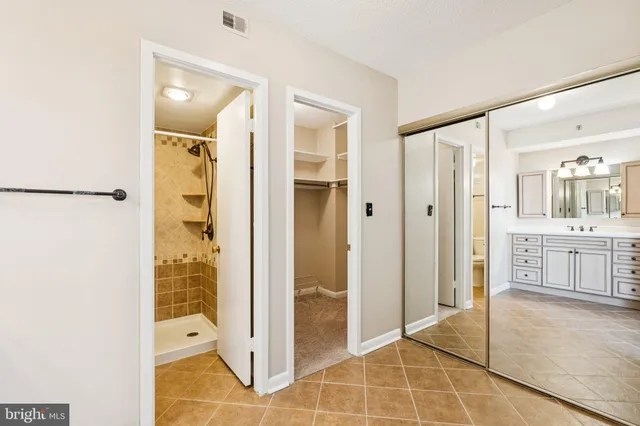 a bathroom with a shower and a sink