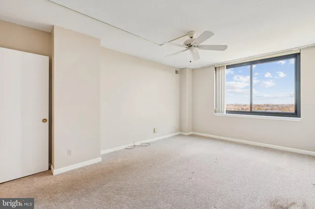 a view of an empty room with a window