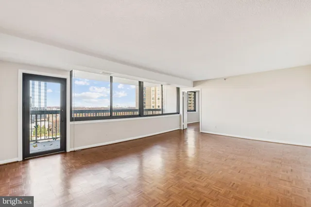 a view of an empty room with a window