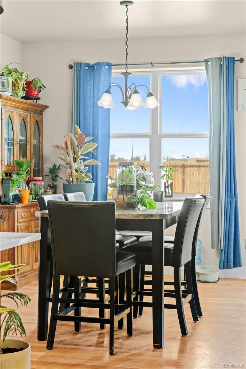 109 7th Avenue Wiggins, CO 80654 - Photo 13 of 38 a view of a dining room with furniture window and outside view