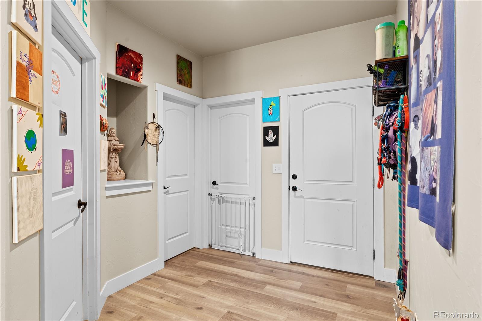 109 7th Avenue Wiggins, CO 80654 - Photo 17 of 38 a view of walk in closet with clothes and shoes